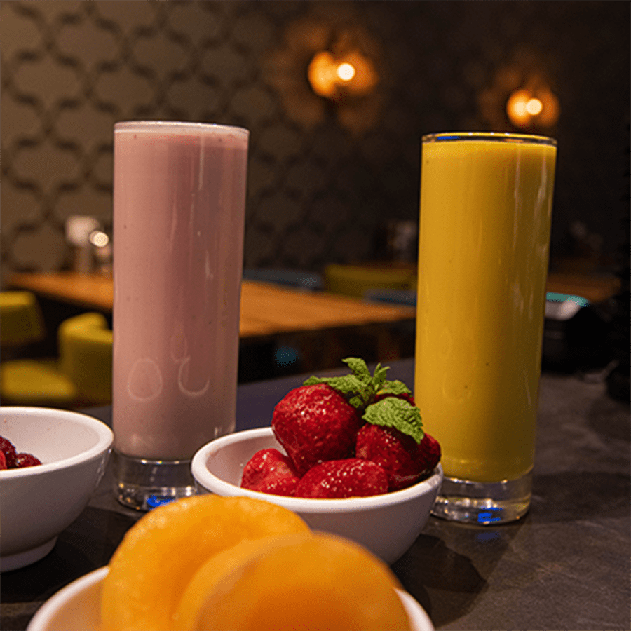 strawberry, mango lassi in a glass